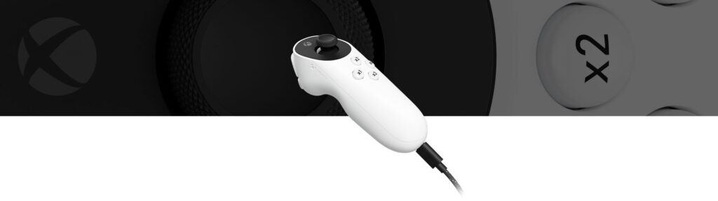 Xbox Adaptive Joystick - A high-quality, detailed close-up view of the Xbox Adaptive Joystick against a soft, blurred background with a warm, inviting lighting. The joystick is prominently displayed, showcasing its ergonomic design and customizable buttons. The image should convey a sense of empowerment and accessibility, highlighting the joystick's ability to enhance gameplay experiences for users with diverse needs. Capture the joystick from a slightly low angle, emphasizing its robust and well-crafted appearance. The overall atmosphere should be one of sleek sophistication and technological innovation.